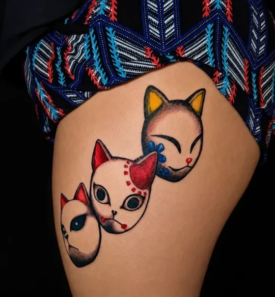 Kitsune cat masks — Color neo-traditional tattoo on thigh