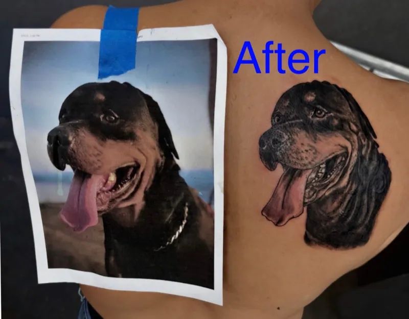 After the cover-up on the shoulder blade: Black-and-gray dog portrait, photographed beside its printed reference.